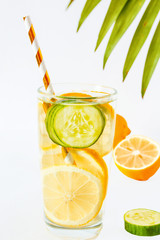 Glass of fresh ice summer drink with lemon on white background. top view. Infused water for diet healthy eating and fat burning with space for a text.
