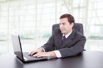 man working with is laptop