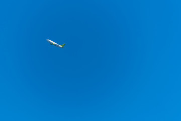 Airplane Climbing High in a Clear Blue Sky