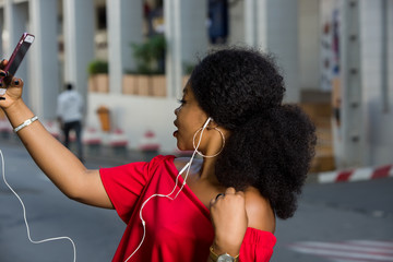 young woman taking pictures on her mobile phone,