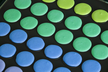 Close-up of macaroon mixture in the black baking tray