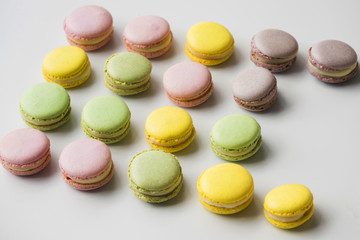 Colorful macaroons on white backdrop
