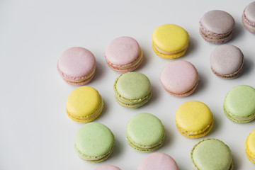 Row of baked macaroon on white desk