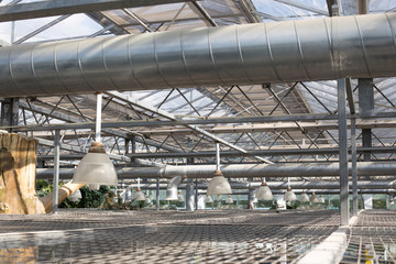 Air Condition pipe line system with glass ceiling. Ceiling air duct and light