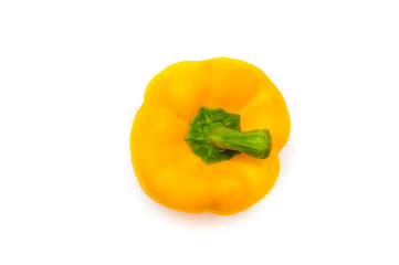 Sweet yellow pepper with green stem isolated on white background. The concept of healthy organic food. Natural organic product. Food for vegetarians and vegans.