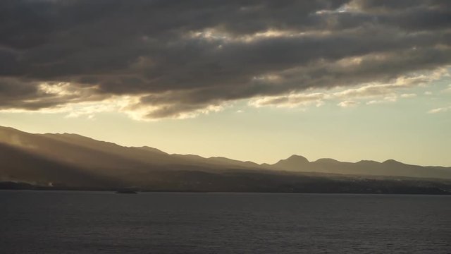 sunset with lots of rays over mountains of Guadeloupe island