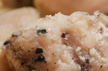 The perfect meat for muscle recovery. Fried cooked chicken breast with spices close-up. Macro shooting.