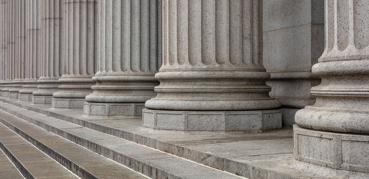 Stone pillars row and stairs detail. Classical building facade