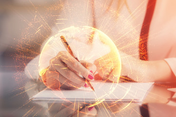 Social network theme hologram over hands taking notes background. Concept of global international people connect. Double exposure