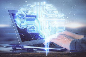 Man typing on keyboard background with brain hologram. Concept of big Data. Double exposure.