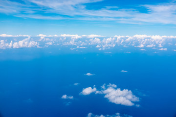 Clouds over the sea. Blue sky with white clouds