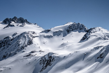 Fototapeta na wymiar Single ski touring track leading up alpine mountain slope