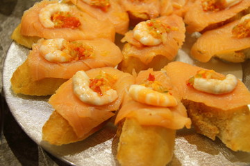 tasty pintxos in spanish restaurant, typical basque snack 