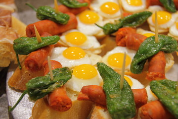 tasty pintxos in spanish restaurant, typical basque snack 