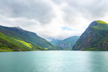 Panoramic view of Geiranger fjord near Geiranger seaport, Norway. Norway nature and travel background. View from the ferry on the fjord in Norway.