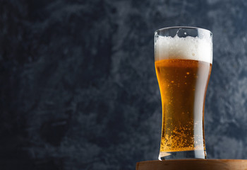 India peel ale in a misted glass on a dark background with copyspace