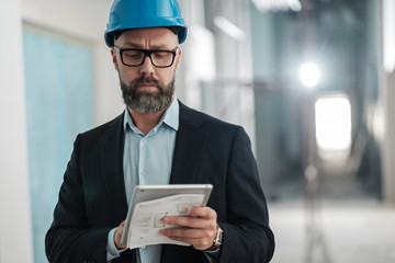 Man engineer with a blueprints