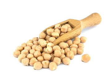Small wooden scoop  with chickpeas seen isolated on white background