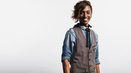 Fototapeta premium Smiling african man in fashionable hairstyle
