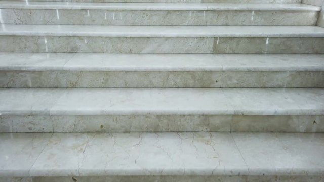 climbing marble steps in the building
