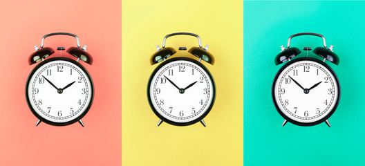 Collage of alarm clocks on different backgrounds. Flat lay composition. Top view. 