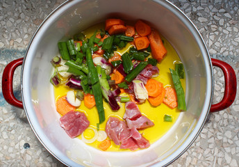 My kitchen, dishes. Lunch in the pot. Carrot, young onion, veal and olive oil. preparing for cooking, from my organic garden, macro photography