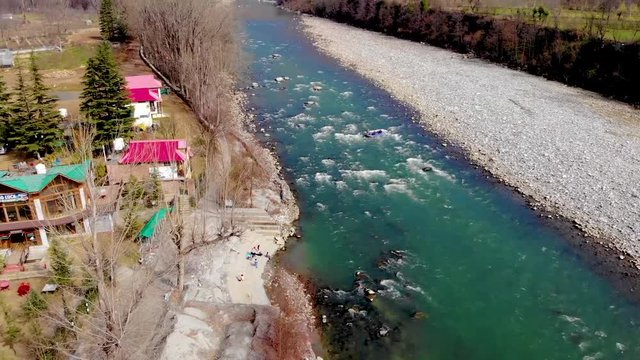 Drone video of river rafting in blue river and mountain valley