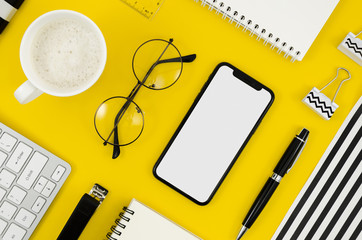 Top view smartphone template over workspace