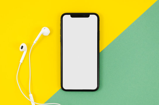 Top view smartphone template over workspace - Powered by Adobe