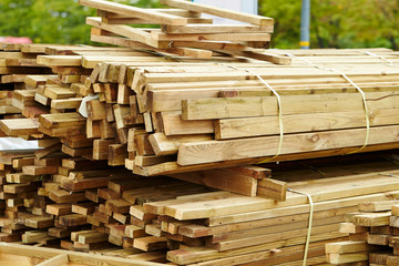 Piled up wooden planks bundles 