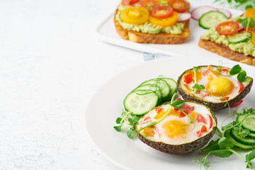 egg baked in avocado, toast, breakfast, closeup, copy space