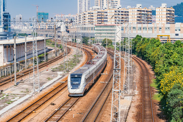 Highspeed train on the railway station at day time.