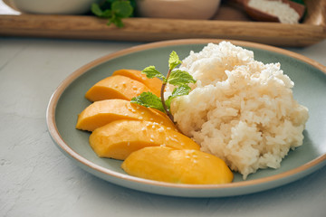 mango with sticky rice - popular traditional dessert of Thailand