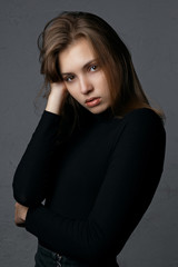 Fototapeta premium Test shooting for wonderful young model with natural makeup wearing black sweater
