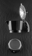black coffee maker on dark stone background good morning concept