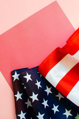 American flag on a light coral background.