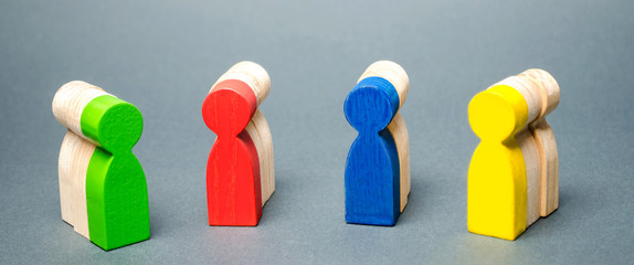 Groups of multicolored wooden people. The concept of market segmentation. Customer relationship management. Target audience, customer care. Groups of buyers. Targeting. Segments