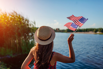 Woman holding USA flag. Celebrating Independence Day of America