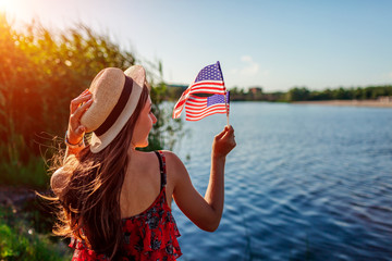 Woman holding USA flag. Celebrating Independence Day of America