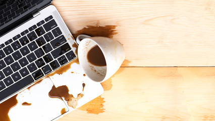 Coffee spilled into a computer notebook