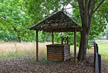 An old wooden well on an abandoned farm