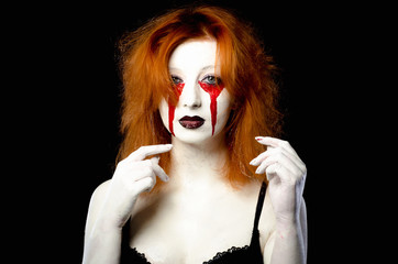Beautiful Young woman as sexy vampire halloween portrait