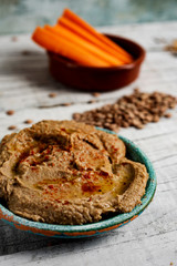 homemade lentil hummus and strips of carrot
