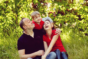 outdoor portrait of a happy family. Mom, dad and child.