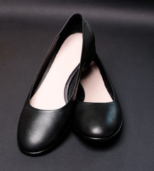 Female black leather ballet shoes