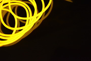 The original yellow lighting of thick electoluminescent wires and lines. Graphic abstract light...