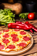 Pizza with cheese and salami