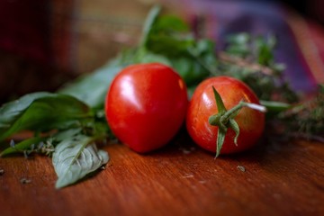 fresh cherry tomatoes on a wooden board