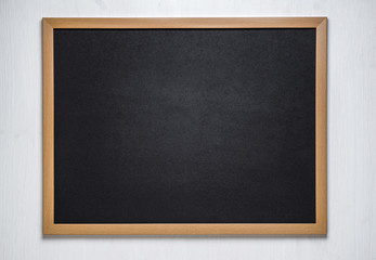 chalk board on a wooden background © solidmaks