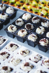 Sweet desserts, pastries on the table during the event. Catering servicing of guests and participants during mass events.